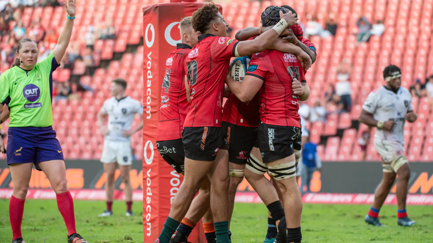 Lions Rugby Team celebrating a try