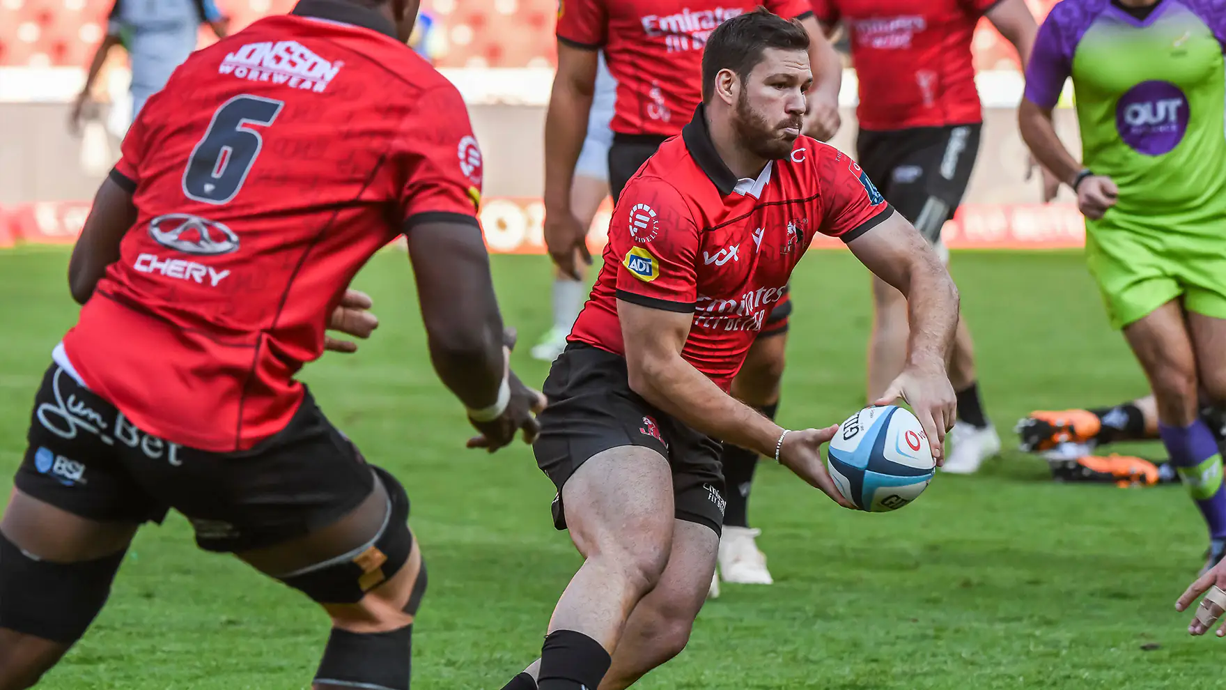 Marius Louw of the Lions rugby team passing the ball in the United RUgby Championship