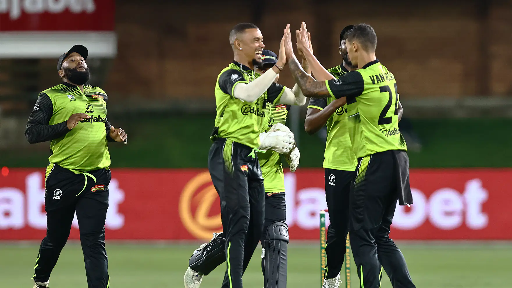 Warriors players celebrate a wicket