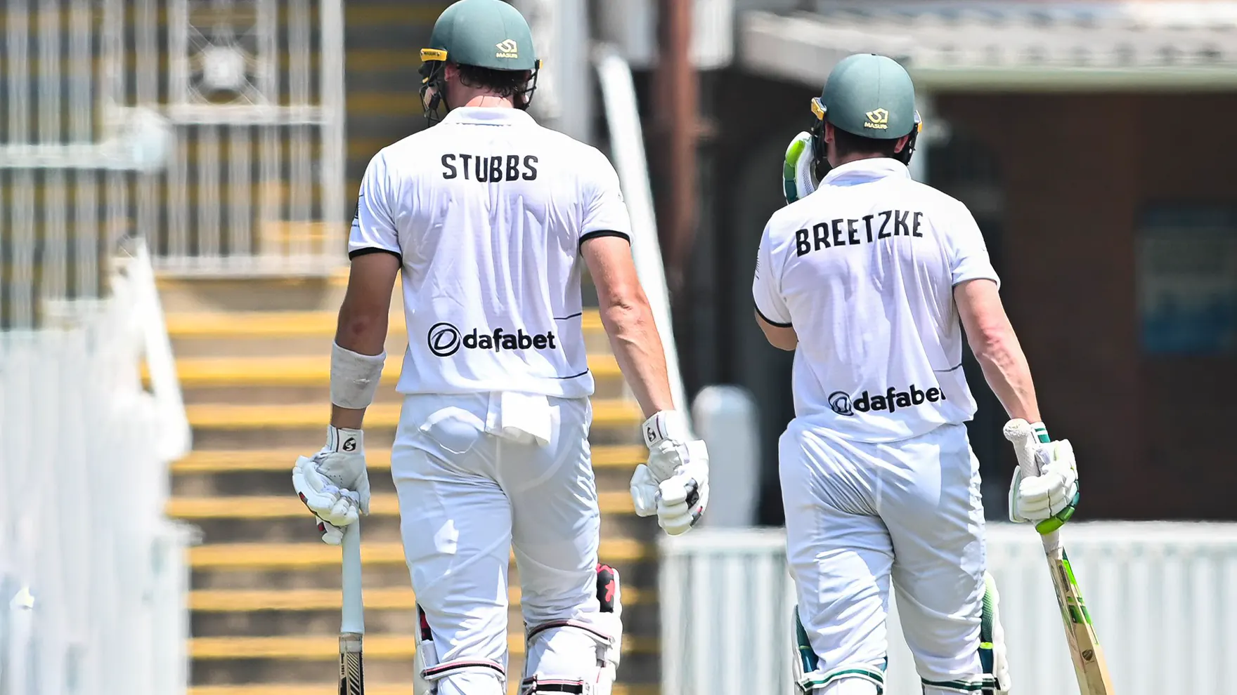 Warriors test batsmen walk off the pitch after an innings