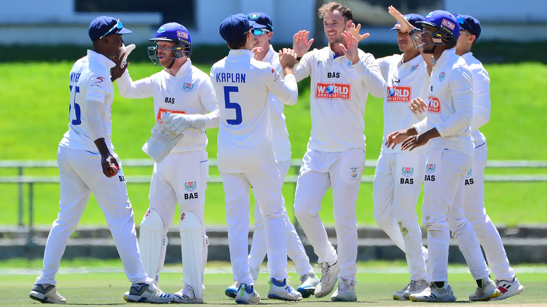 WP cricket test team celebrating a wicket