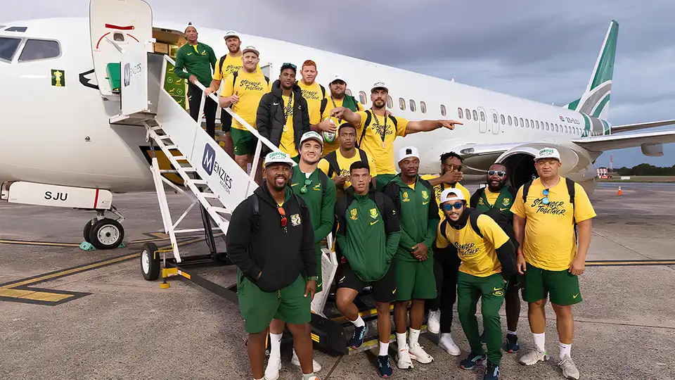  Springboks Rugby Team Standing Next to FlySafair Airplane