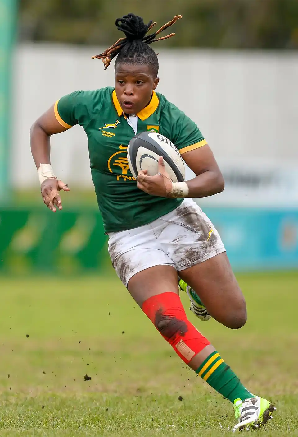 Springboks Women player running with a rugby ball