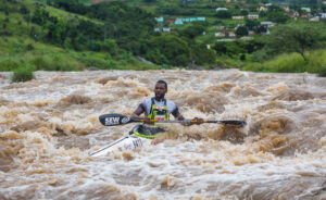 Paddler competing in the Dusi Canoe Marathon, showcasing sports sponsorships, rights management, and sports marketing services by Megapro, a leading South African agency