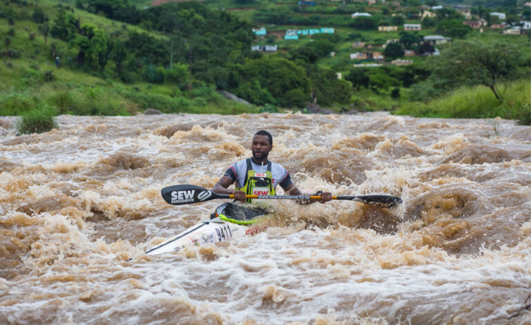 Paddler competing in the Dusi Canoe Marathon, showcasing sports sponsorships, rights management, and sports marketing services by Megapro, a leading South African agency