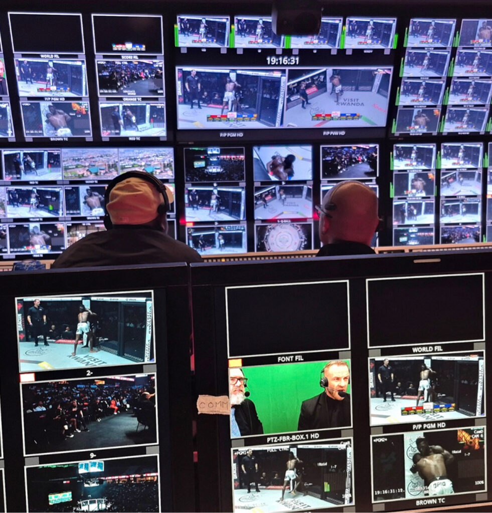 Production team creating promotional sports video content with graphics and editing